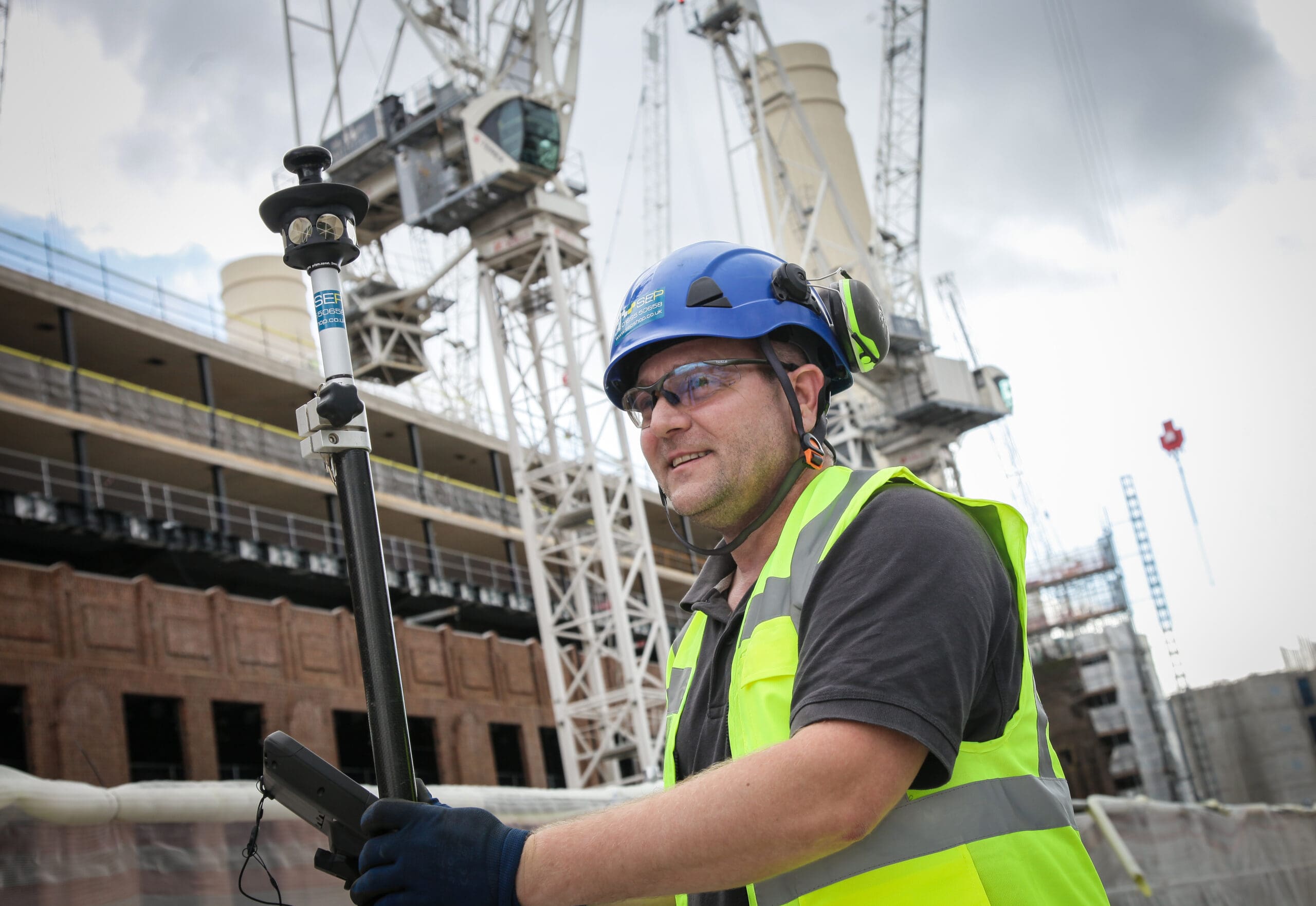 Setting out engineer working on site in Havering